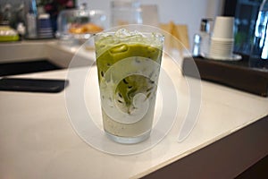 Iced green tea milk  in a cafe