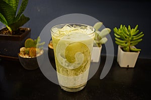 Iced green tea milk  in a cafe