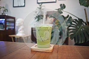 Iced green tea milk  in a cafe