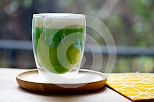 Iced green tea with milk foam