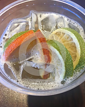 Iced green tea with orange and lime