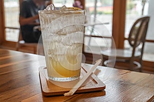 Iced honey lemon soda in glass available in cute minimal cafe