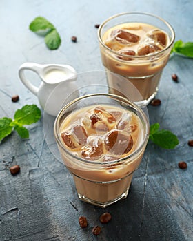 Iced latte coffee in a glass with cold milk. Summer drink