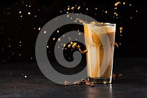 Iced latte coffee glass with splash