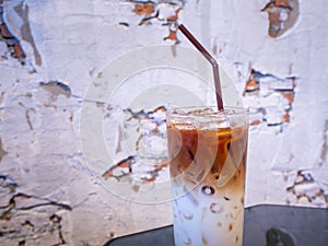 Iced latte coffee glass on wooden table