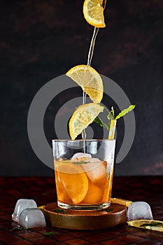 Iced lemon tea in motion concept.