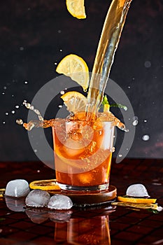 Iced lemon tea in motion concept.