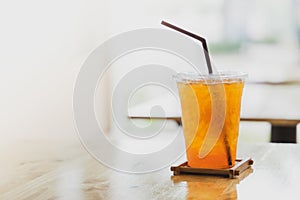 Iced lemon tea in plastic cup.