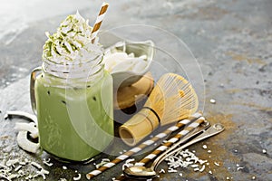 Iced matcha latte with coconut cream photo