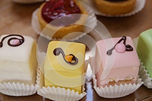 Iced mini cakes named Petit four glace. Delicious for a high tea