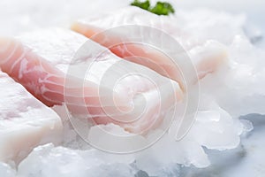 Iced raw cod fish fillets