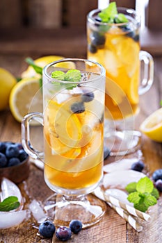 Iced tea with blueberries and lemon slices