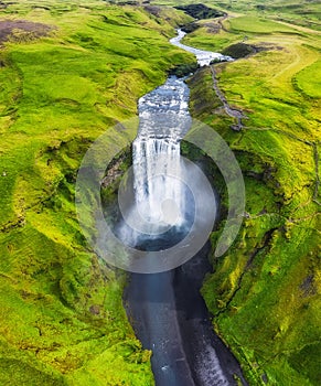 Iceland. Aerial view on the Skogafoss waterfall. Landscape in the Iceland from air. Famous place in Iceland. Landscape from drone.