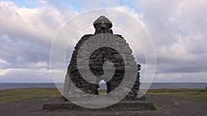 Iceland Arnarstapi Rock Sculpture Troll. Camera Tilts Up