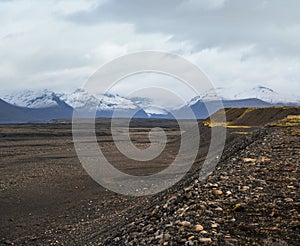 Iceland autumn tundra landscape near Haoldukvisl glacier, Iceland. Glacier tongue slides from the Vatnajokull icecap or Vatna