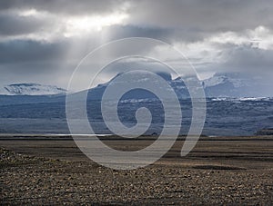 Iceland autumn tundra landscape near Haoldukvisl glacier, Iceland. Glacier tongue slides from the Vatnajokull icecap or Vatna