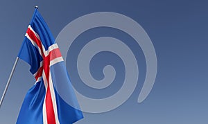 Iceland flag on flagpole on blue background. Place for text. The flag is unfurling in wind. Europe, Reykjavik. Icelandic. 3D