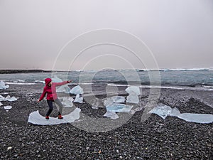 Iceland - Girl surfing on an ice piece