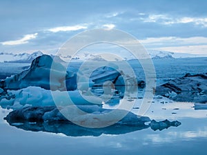 Iceland - Glacier lagoon with drifting icebergs and the glacier itself in the back