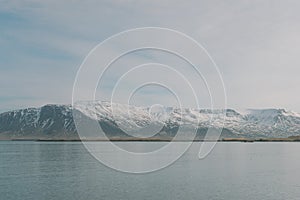 Iceland landscape photography.Snowy mountains in the background. Picture shot close to Reykjavik.