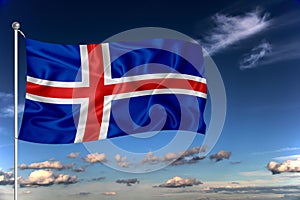 Iceland national flag waving in the wind against deep blue sky.  International relations concept