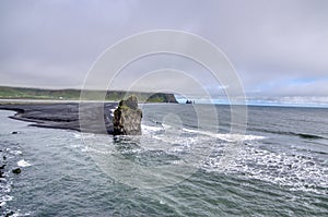 Iceland, Reynisfjara Beach, cliffs and characteristic stretch of sea