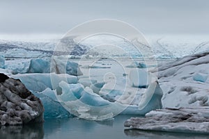Iceland`s glacier Jokulsarlon through the breakaway icebergs