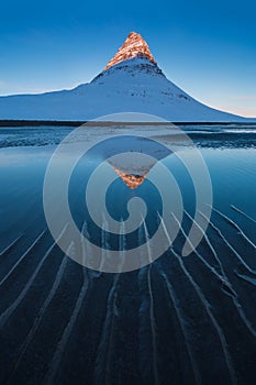 Iceland snaefellsnes peninsula and famous Kirkjufell. Kirkjufell is a beautifully shaped and a symmetric, free standing mountain.