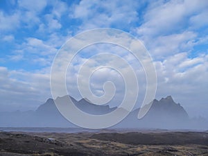 Iceland -  Tall mountains hiding in the mist