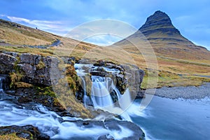 Iceland timelapse photography of waterfall and famous mountain. Kirkjufellsfoss and Kirkjufell in northern Iceland nature