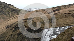 Iceland Waterfall Skogafoss in Beautiful Icelandic Landscape.