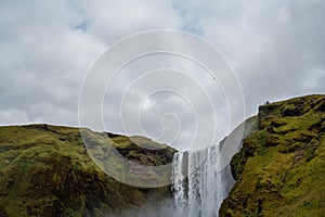 Iceland waterfall Skogafoss in Icelandic nature landscape. Famous tourist attractions and landmarks destination in Icelandic