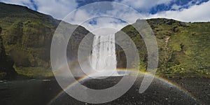 Iceland waterfall Skogafoss in Icelandic nature landscape at summer time