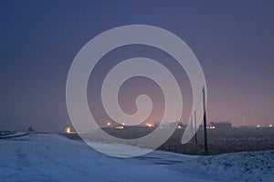 Iceland winter night landscape, snowy, road, outdoors, city lights, empty space above