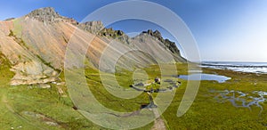 Icelandic aerial landscape with a viking village in Stokksnes. Panorama of Vestrahorn mountain