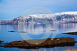Icelandic fjord reflected in the water