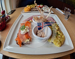 Icelandic food sample platter with fermented shark