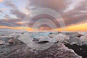 Icelandic glacier Jokulsarlon with icebergs on the beach