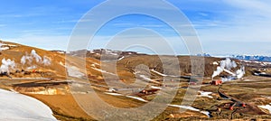 Icelandic landscape with geothermal power plant station and pipe