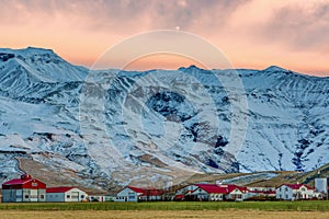 The Icelandic village of Thorvaldseyri with the infamous eyjafjallajokull volcano behind at sunrise