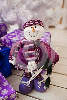 Iceman and white christmas tree with presents