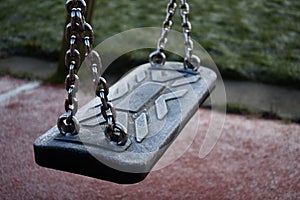 Icey Empty Swing In A Playground photo