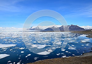 Icey Lagoon with Snow Capped Mountains in Iceland