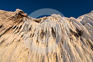 Icicle hanging on cliff in Baikal frozen lake in winter season, Siberia, Russia