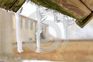 Icicle hanging from an eaves in the winter of a town in Spain. Tamariz de Campos, Valladolid, Castile and Leon