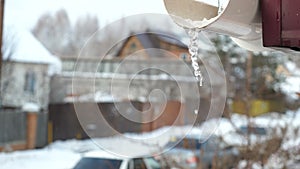 Icicle hanging from the roof.