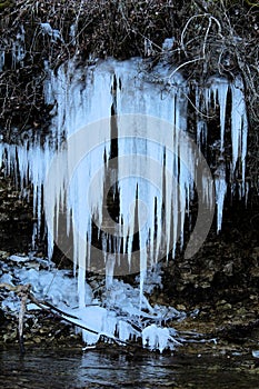 Icicle over a creek Ice Sickles photo