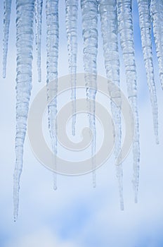 Icicles against blue sky