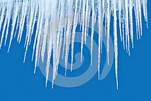 Icicles on blue background