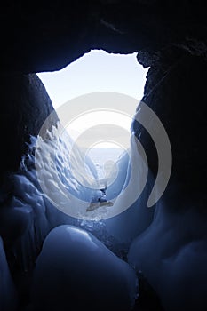 Icicles in cave. Lake Baikal, Oltrek island. Winter landscape